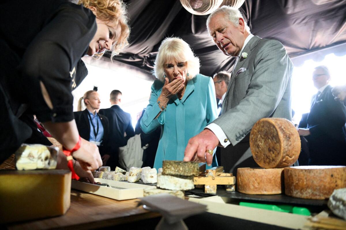 Britain's King Charles and his wife Queen Camilla sample some cheese during a visit to a festival in celebration of British and French culture and business at Place de la Bourse in Bordeaux, southwestern France, on September 22, 2023. — Reuters file