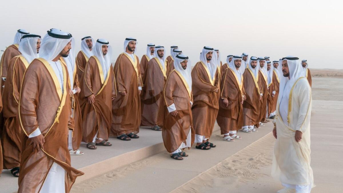 Sheikh Hamdan bin Zayed Al Nahyan meets the grooms at the mass wedding in Al Dhafra. — Wam