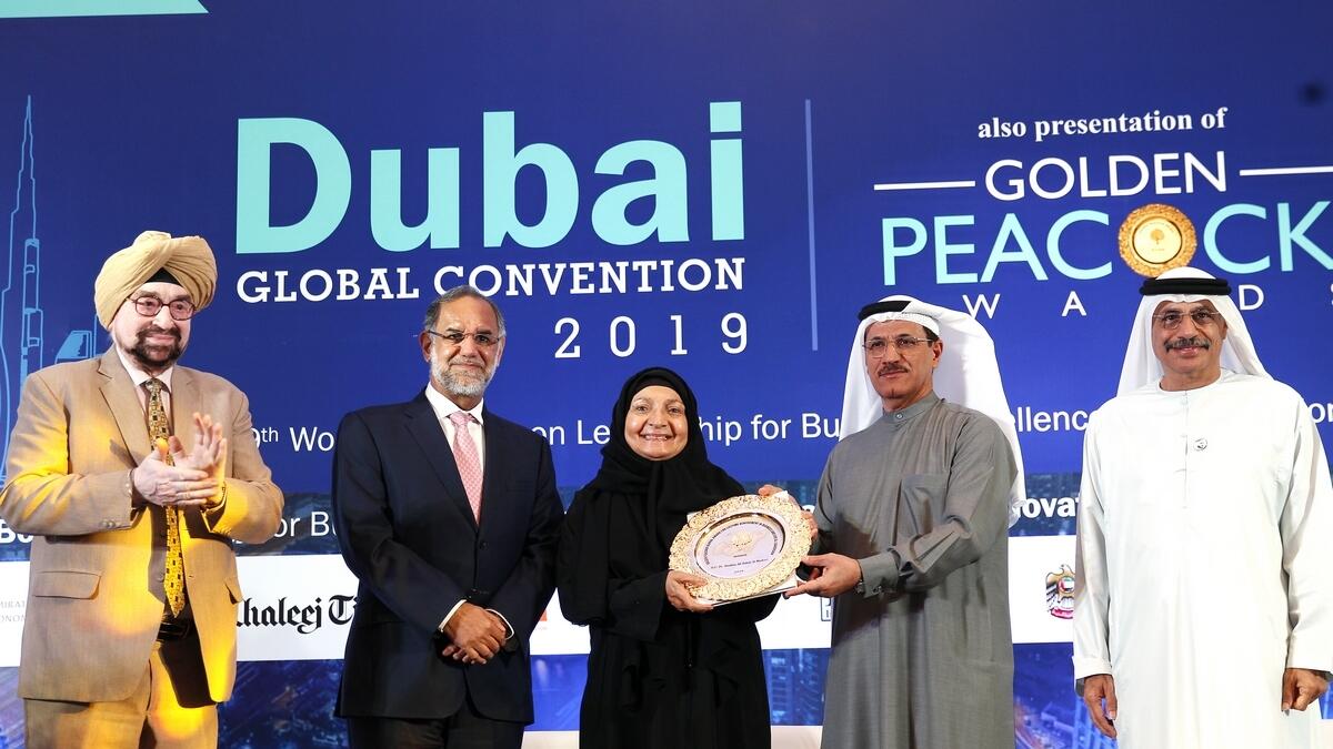 Dr Shaikha Ali Salem Al Maskari, chairperson of Al Maskari Holding, receiving the Golden Peacock Global Award for Lifetime Achievement in Business and Social Leadership from Sultan bin Saeed Al Mansouri. Looking on are Navdeep Singh Suri, Ambassador of India to the UAE; J.S. Ahluwalia, president of the Institute of Directors India and Dr Tayeb Kamali, chairman of IOD India UAE Chapter.