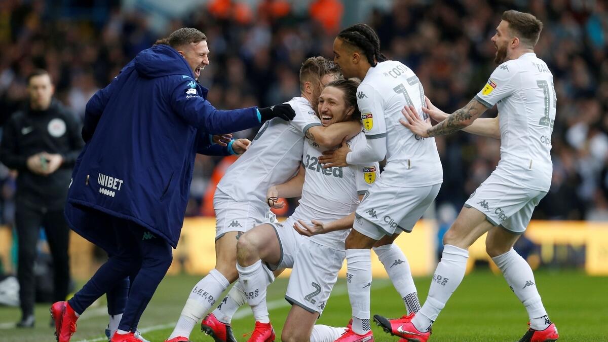 Leeds ended a 16-year wait to return to the top-flight after second-placed West Bromwich Albion's defeat at Huddersfield Town on Friday