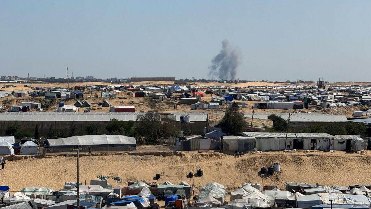 Smoke rises during an Israeli ground operation in Khan Younis as seen from a tent camp sheltering displaced Palestinians in Rafah. — Reuters