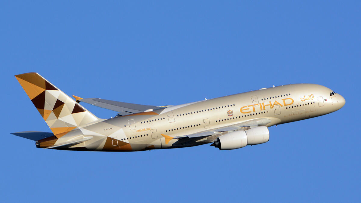 Etihad, flight diverted, smoke from tablet