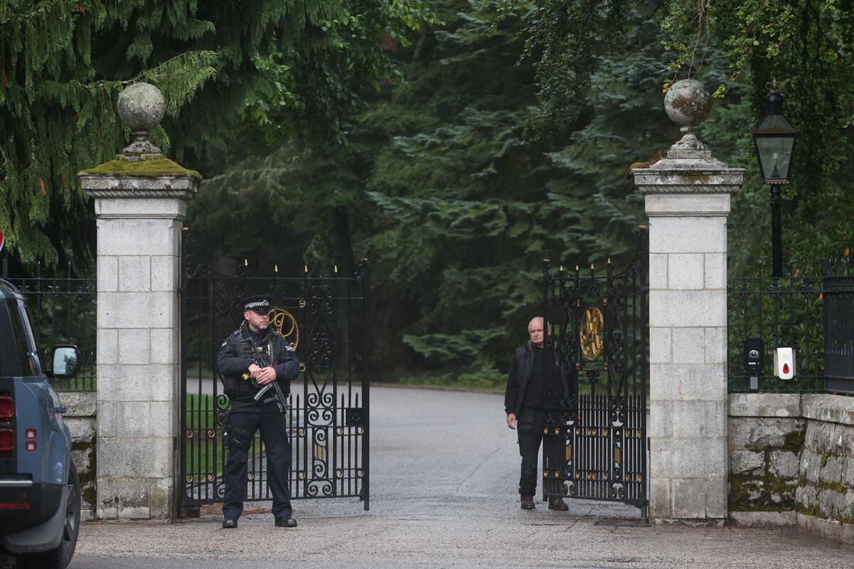 Security officers guard the gates of Balmoral Castle. Photo: Reuters