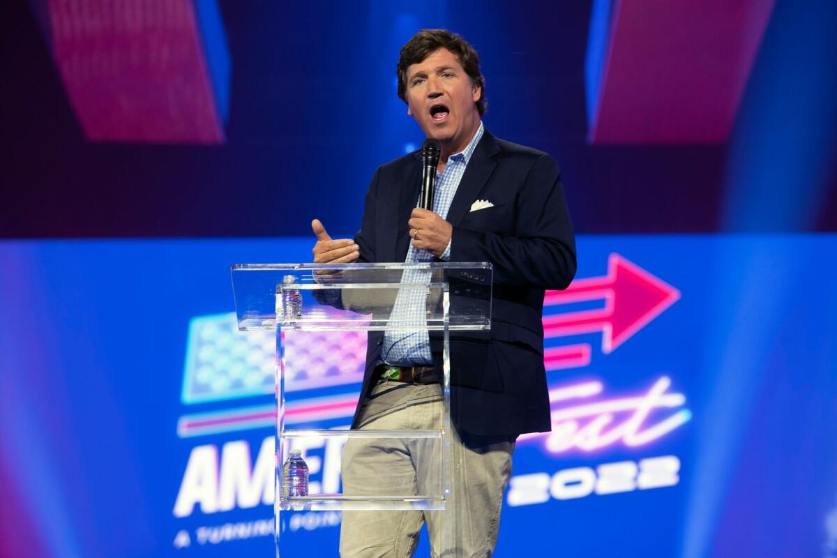 Tucker Carlson speaks in Phoenix on December 17, 2022. Fox News said on Monday that it is parting ways with Carlson, its most popular prime time host. (Rebecca Noble/The New York Times)