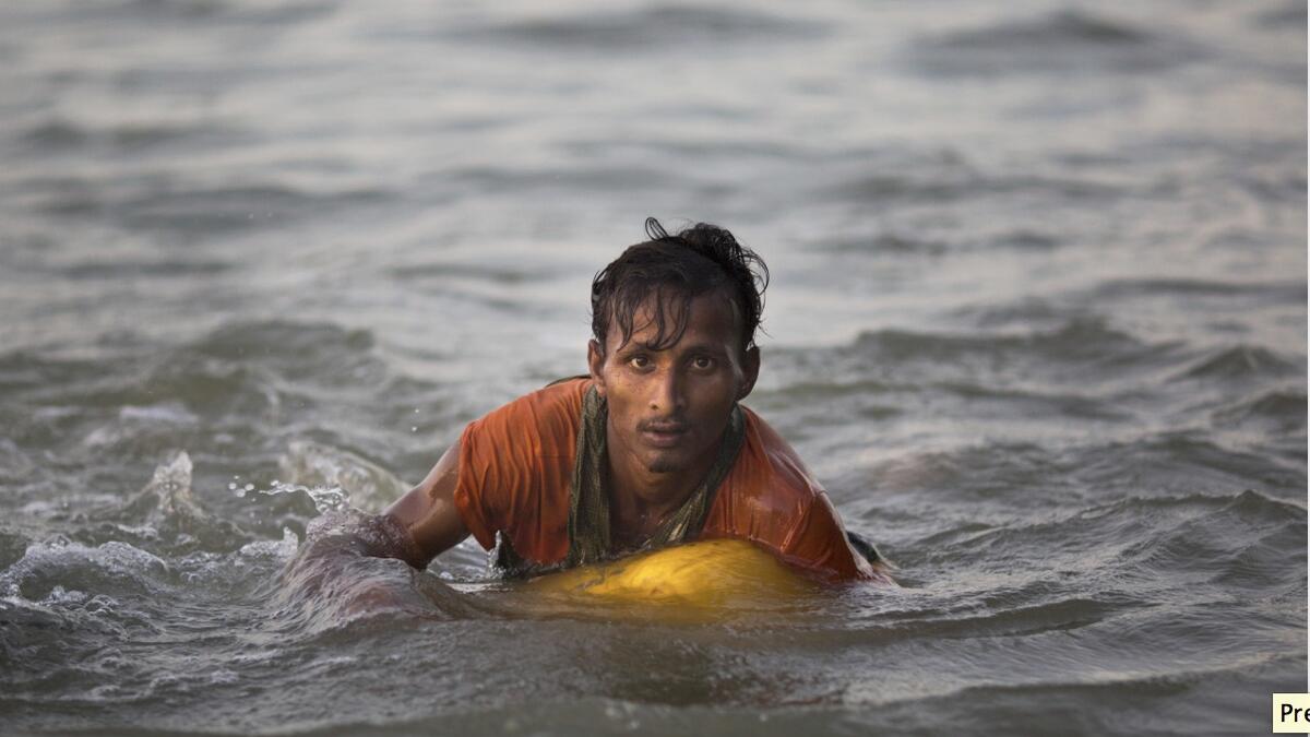 Myanmar boy cant swim but floats on oil drum to Bangladesh