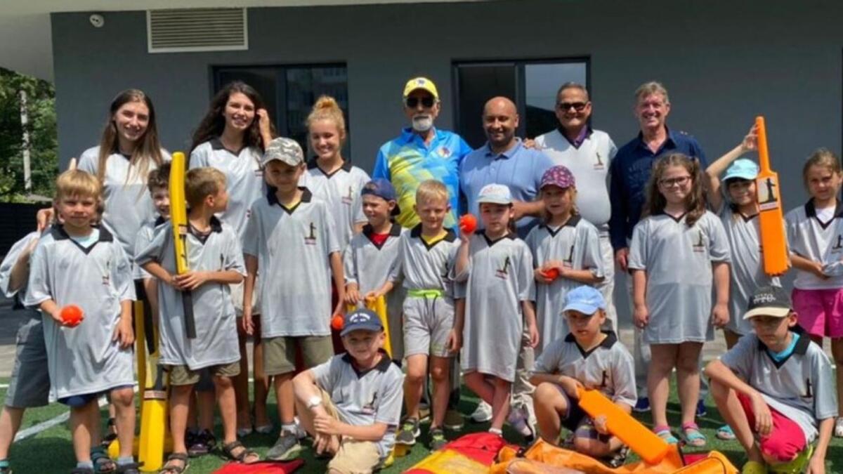 Kobus Olivier (right, back row), Dinesh Kothari, Andrei Pilleroa, Shyam Bhatia and students at Astor Irpin School in Ukraine. Olivier was helping cricket grow in Ukraine until the start of the Russian conflict. (Supplied photo)