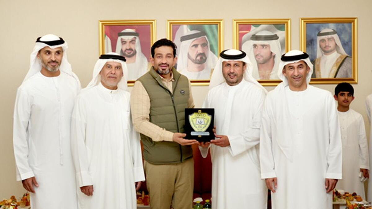 Iqbal Marconi receives a token of appreciation from Ahmad Muhammed bin Shafar, CEO of Empower and chairman at Al Wasl Club Dubai.