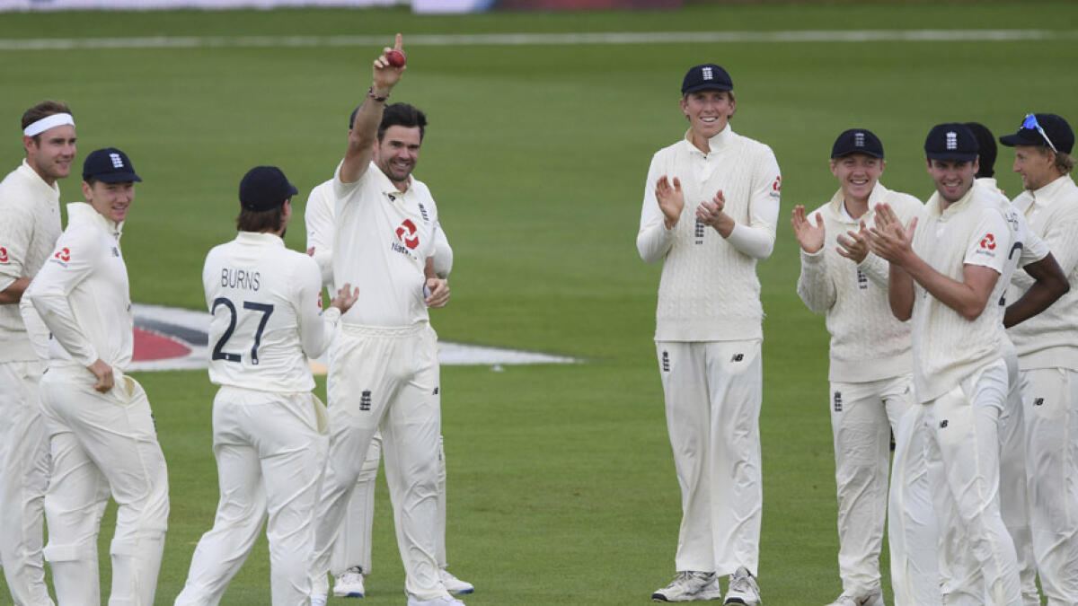 England's James Anderson celebrates with teammates after claiming his 600th Test wicket. Anderson dismissed Pakistan's captain Azhar Ali during the fifth day of the third cricket Test match on Tuesday. - AP