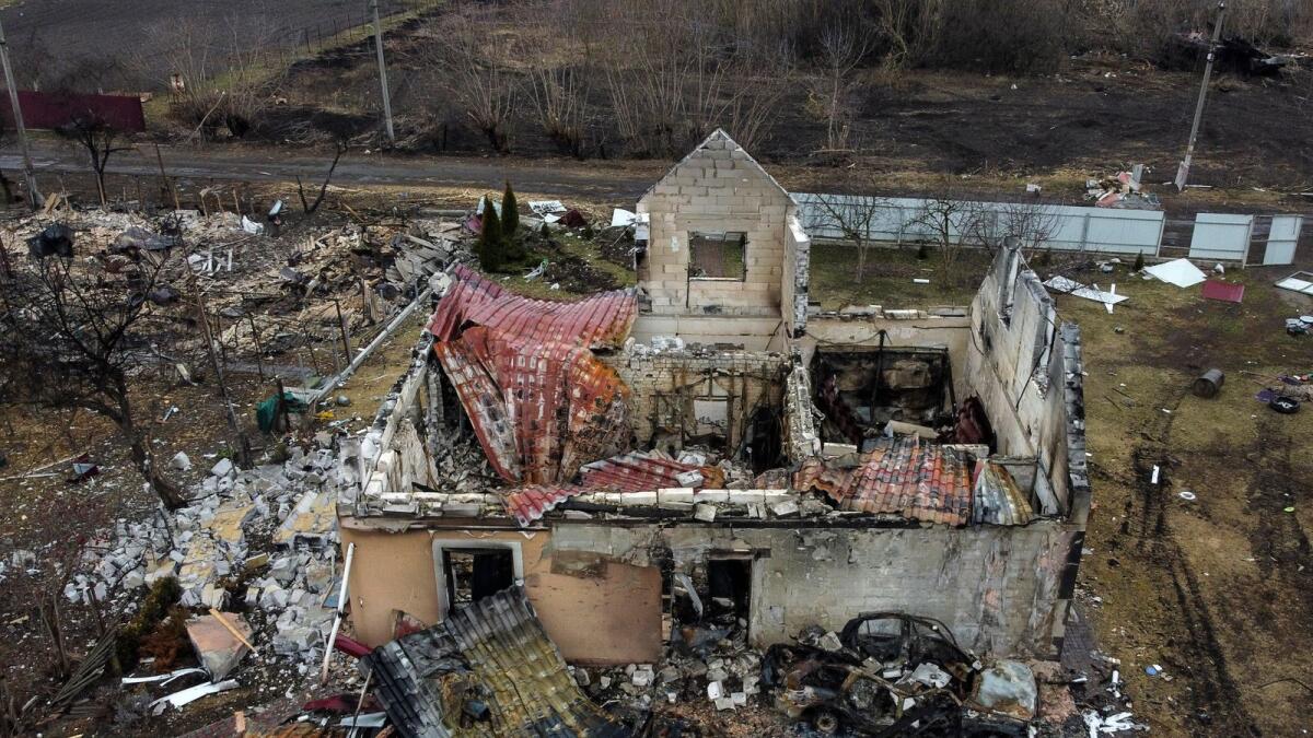 This aerial view taken near Kyiv on March 30, 2022 shows a destroyed house in the village of Lukianivka. Photo: AFP