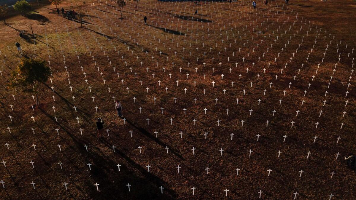 An aerial view taken during a protest against Brazilian President Jair Bolsonaro and in honour of the people who died of Covid-19 in which 1,000 crosses were placed in front of the National Congress in Brasilia, Brazil. Photo: AFP