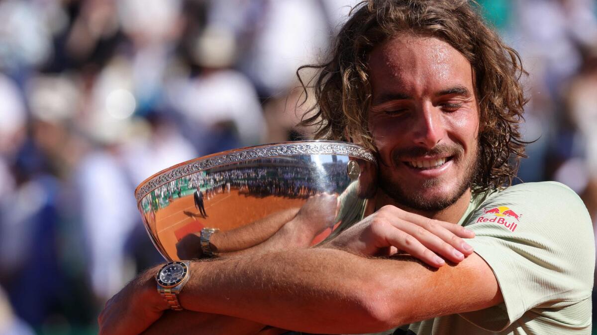 Stefanos Tsitsipas celebrates with his trophy. (AFP)