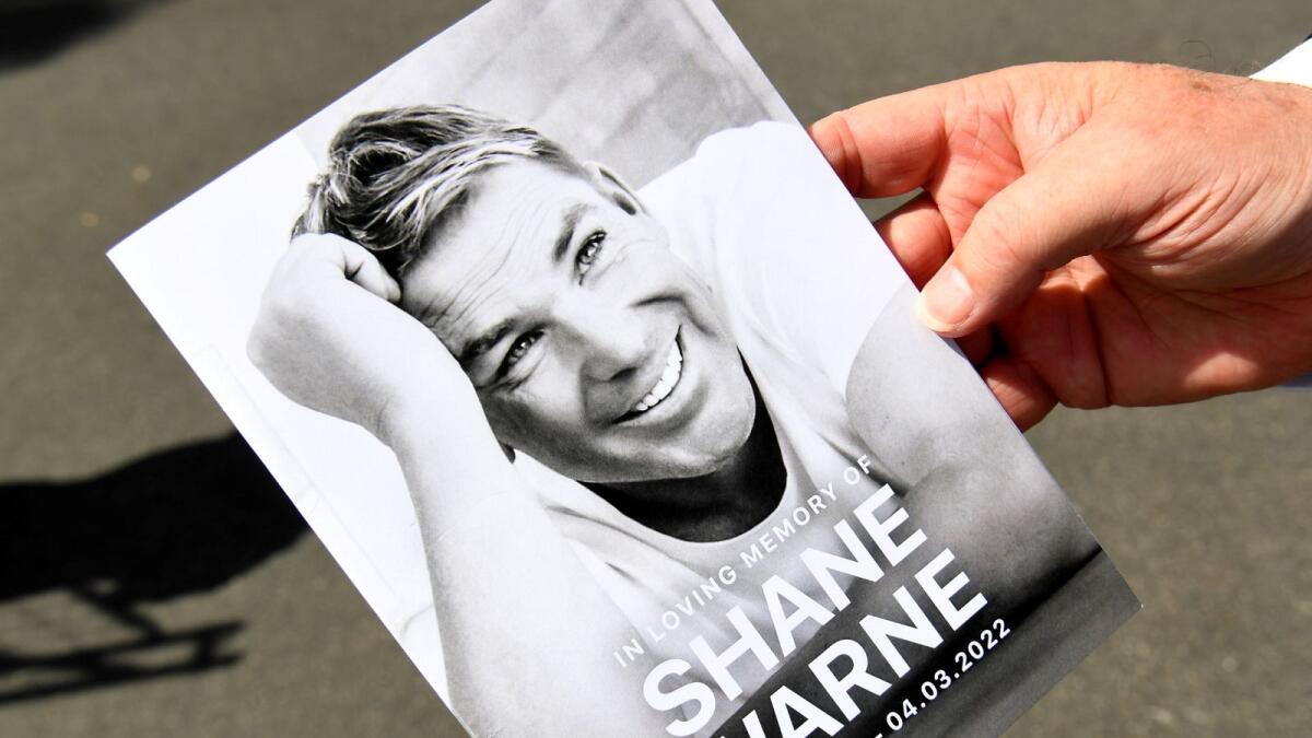 A funeral program is held after a private memorial service for Australian cricket superstar Shane Warne in Melbourne on March 20, 2022. Photo: AFP