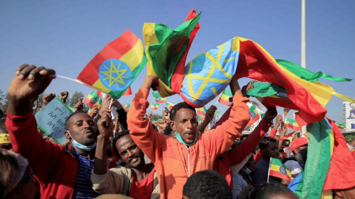A man holds the Ethiopian national flag during a pro-government rally to denounce the Tigray Peopleâs Liberation Front (TPLF) and the Western countries' interference in internal affairs of the country, at Meskel Square in Addis Ababa. — Reuters