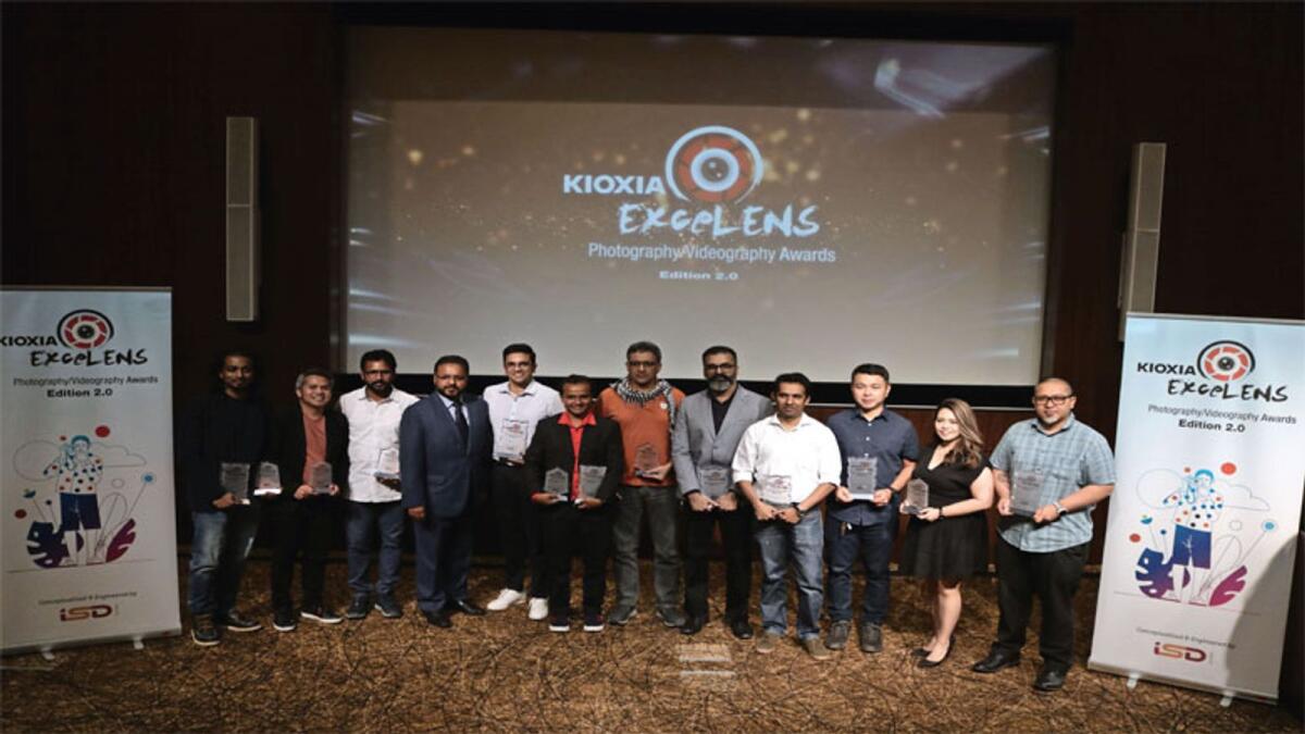Santosh Varghese, vice president, Toshiba Gulf FZE, with some ofthe winners of the Kioxa ExceLENS Awards.