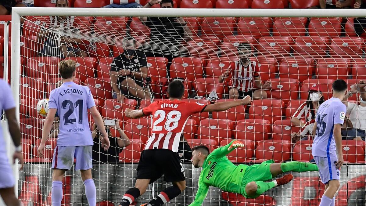 Athletic Bilbao's Inigo Martinez scores a goal against Barcelona during the Spanish La Liga soccer match. — AP