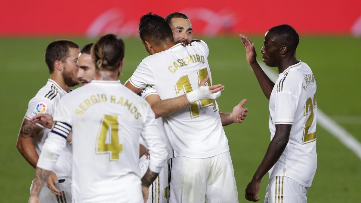 Real Madrid's Karim Benzema (second from right) celebrates with his teammates after scoring (AP)