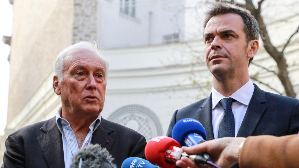 French immunologist Jean-Francois Delfraissy addresses the press as French Health and Solidarity Minister Olivier Veran  listens in Paris. Photo: AFP