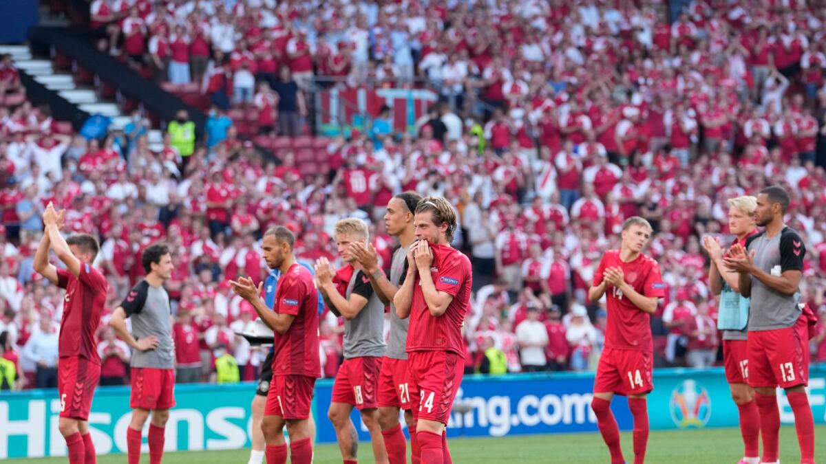 Danish players applaud their fans after the Euro 2020 match against Belgium in Copenhagen on Thursday. (AP)