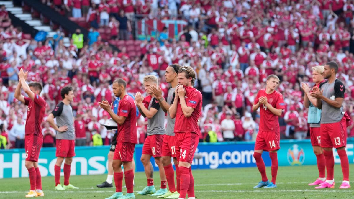 Danish players applaud their fans after the Euro 2020 match against Belgium in Copenhagen on Thursday. (AP)