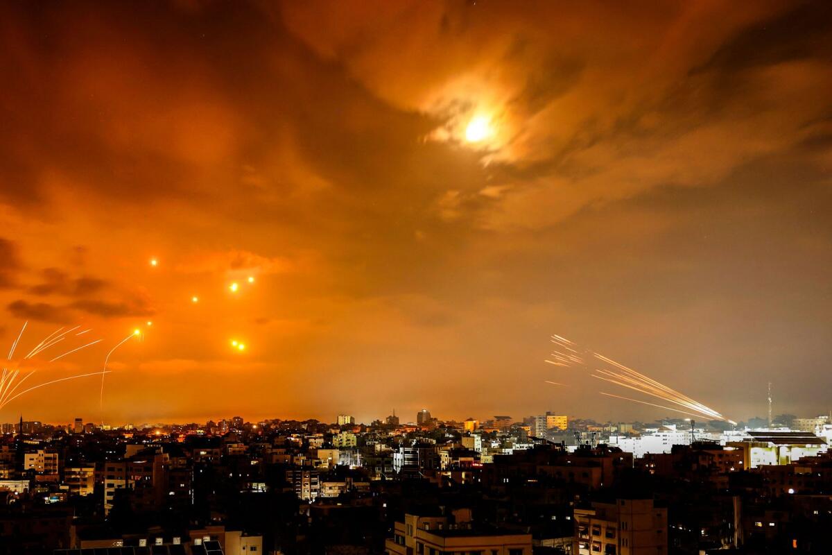 Rockets fired by Palestinian militants from Gaza City are intercepted by the Israeli Iron Dome defence missile system in the early hours of October 8, 2023. Photo: AFP