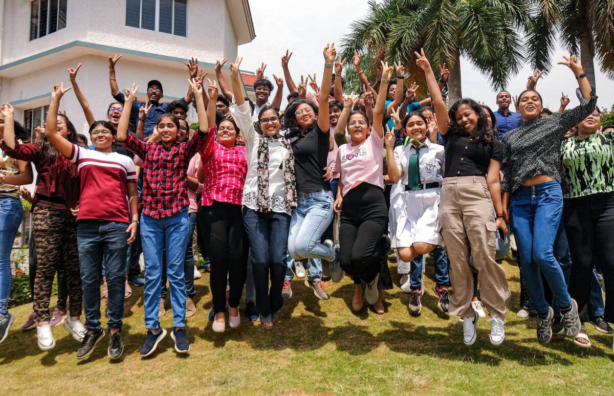 Students celebrate their success after announcement of 12th class results by Central Board of Secondary Education in Ranchi on Friday. Photo: PTI