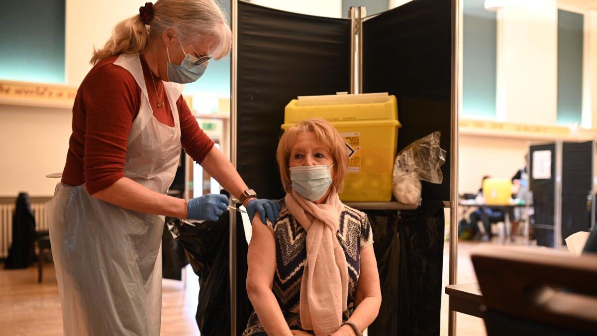 A doctor administers an injection of Covid-19 vaccine at a vaccination centre in Thornton-Cleveleys, northwest England.