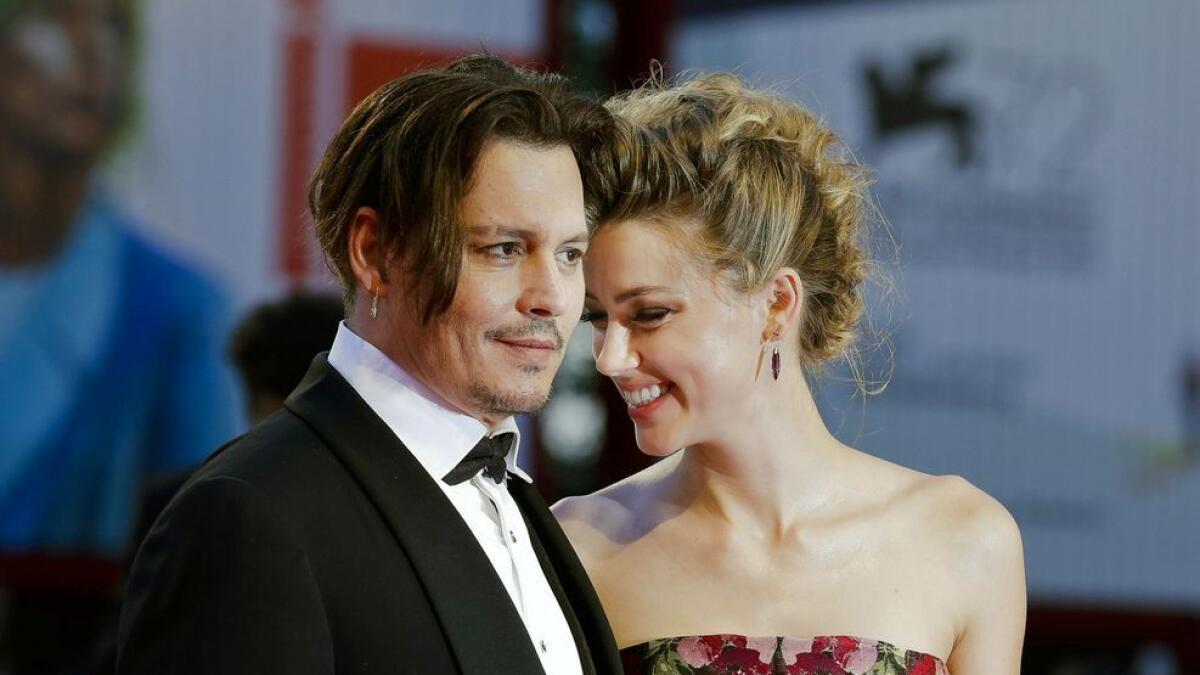 Johnny Depp and Amber Heard arrive at the premiere of The Danish Girl during the 72nd edition of the Venice Film Festival in Venice, Italy