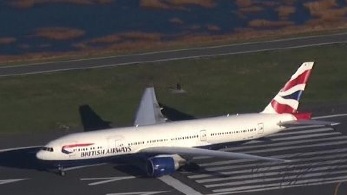 Passenger tries to open exit door on London-Boston flight