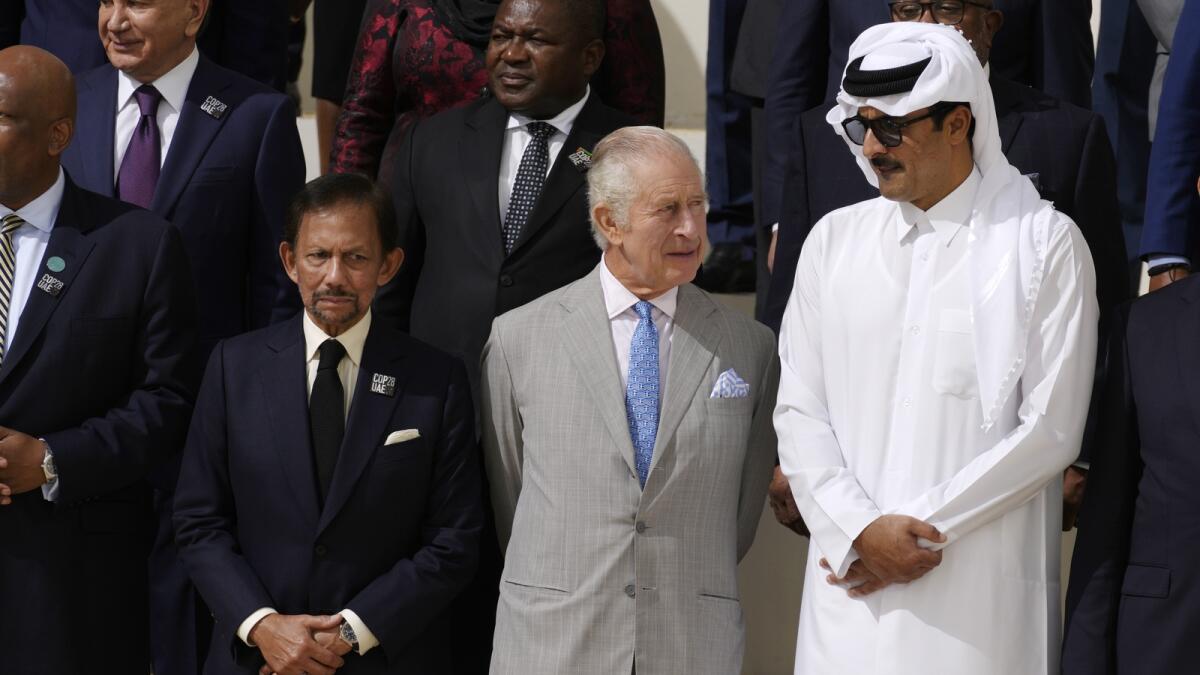 Brunei Sultan Hassanal Bolkiah, left, King Charles III, and Qatar Emir Sheikh Tamim bin Hamad Al Thani attend a group photo. - AP