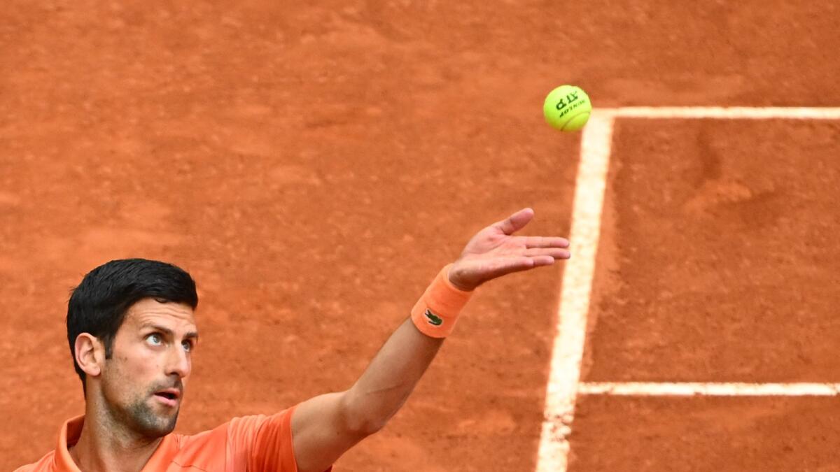 Novak Djokovic serves to Gael Monfils during their match in Madrid. (AFP)