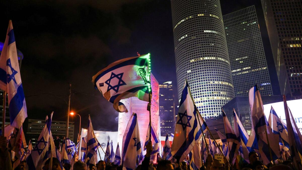 People take part in a demonstration against Israeli Prime Minister Benjamin Netanyahu and his nationalist coalition government's plan for judicial overhaul in Tel Aviv on Saturday. — Reuters