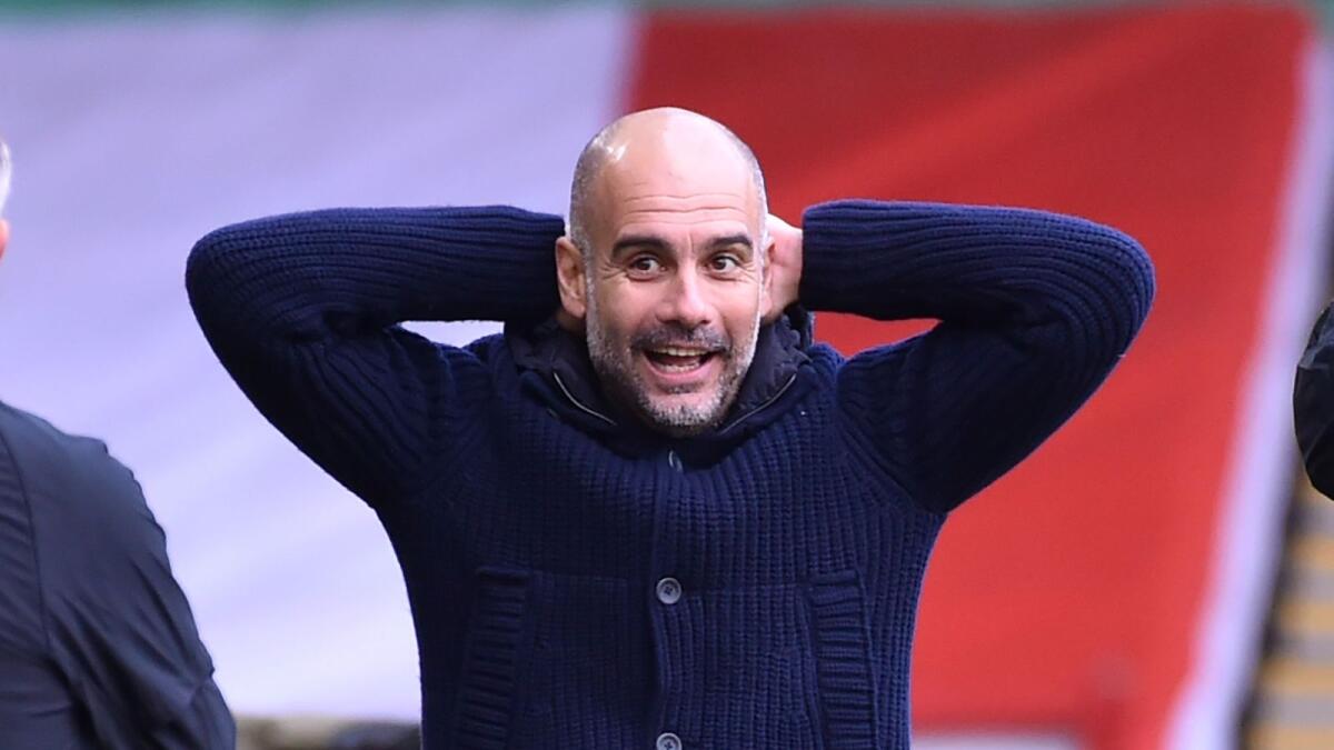 Pep Guardiola gestures during the English Premier League match against Sheffield United. — AFP