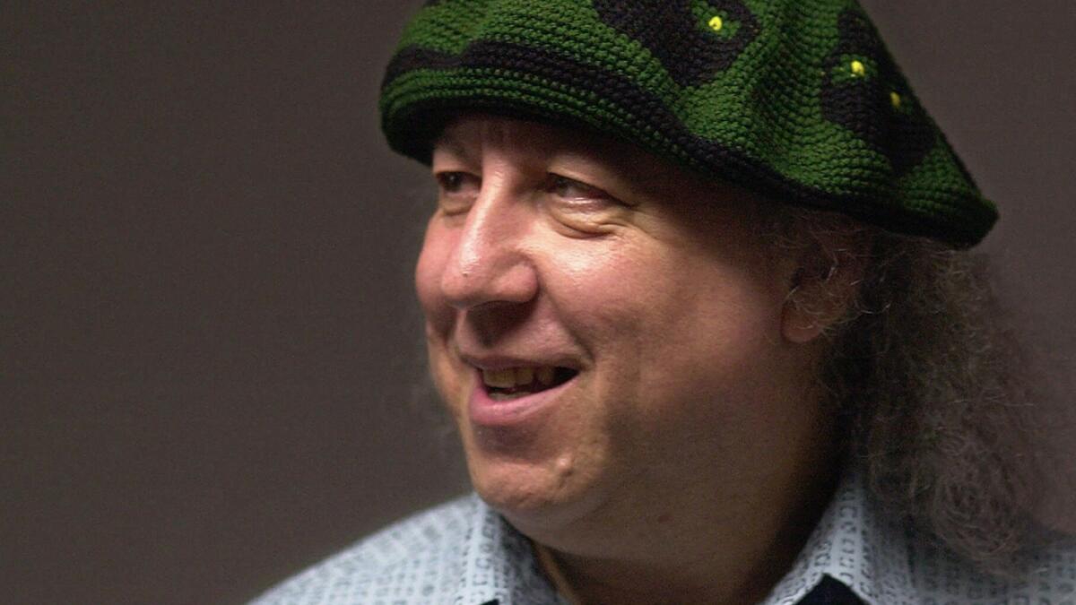 In this file photo British rock and blues guitarist Peter Green, a founding member of Fleetwood Mac, backstage before performing with his own band, Peter Green's Splinter Group, at B.B. King Blues Club &amp; Grill, in New York. Lawyers representing the family of Peter Green, say in a statement  that he has died, aged 73. AP