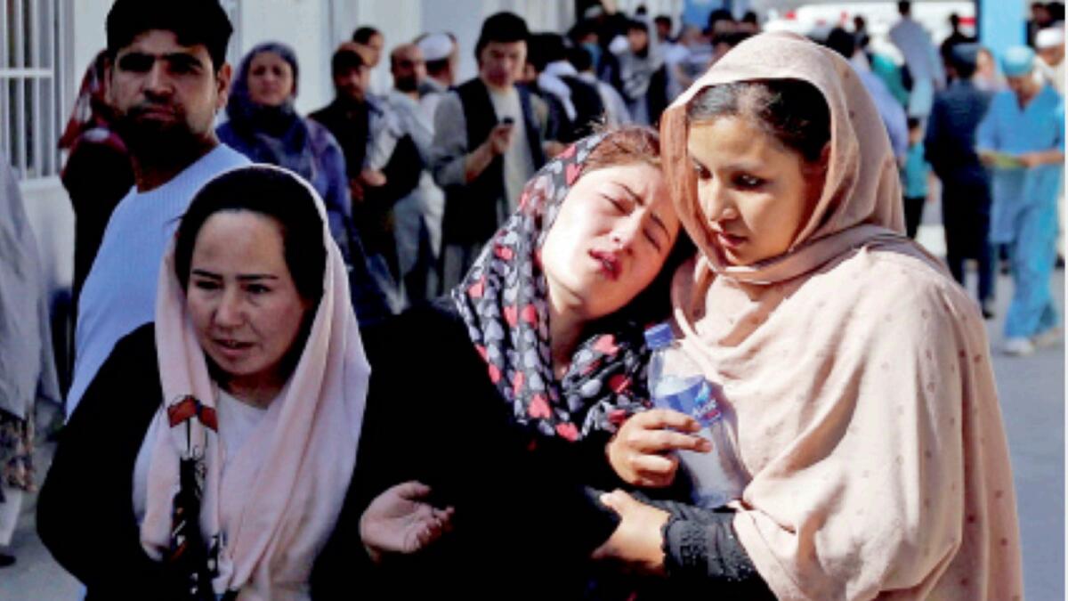 Afghan women mourn inside a hospital compound after a suicide attack in Kabul in 2017. — Reuters file
