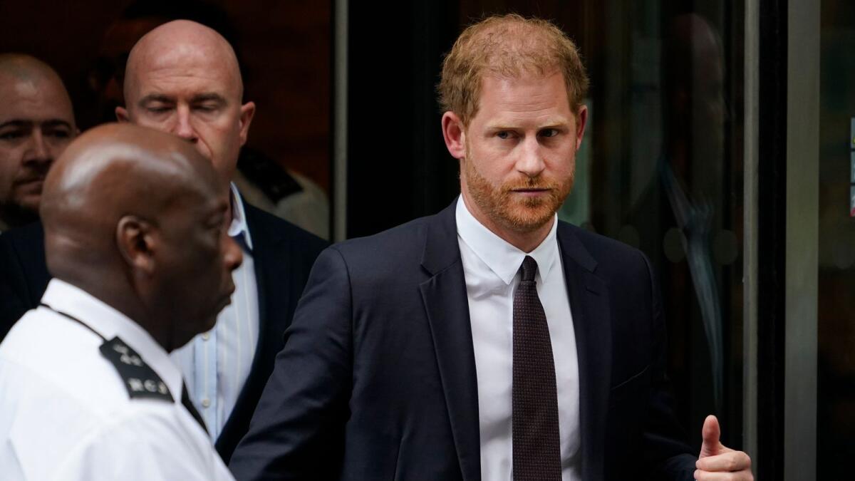 Prince Harry leaves the High Court after giving evidence in London, on Tuesday. — AP