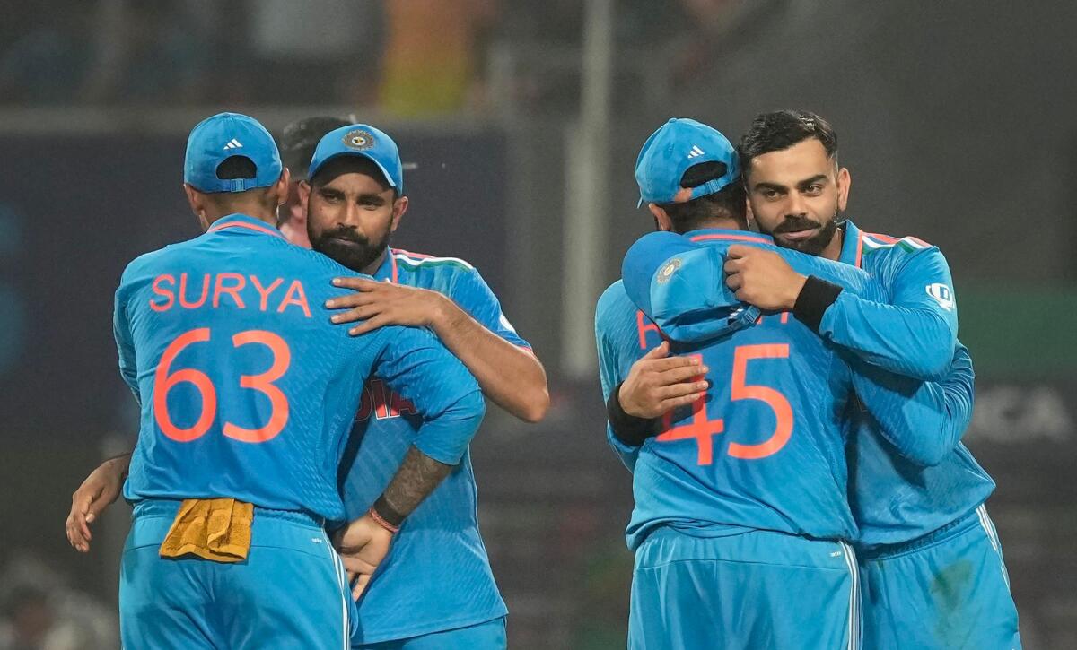 Indian players greet each other at the end of their ICC Men's Cricket World Cup 2023 match against South Africa, at Eden Gardens in Kolkata, Sunday, Nov. 5, 2023. Photo: PTI