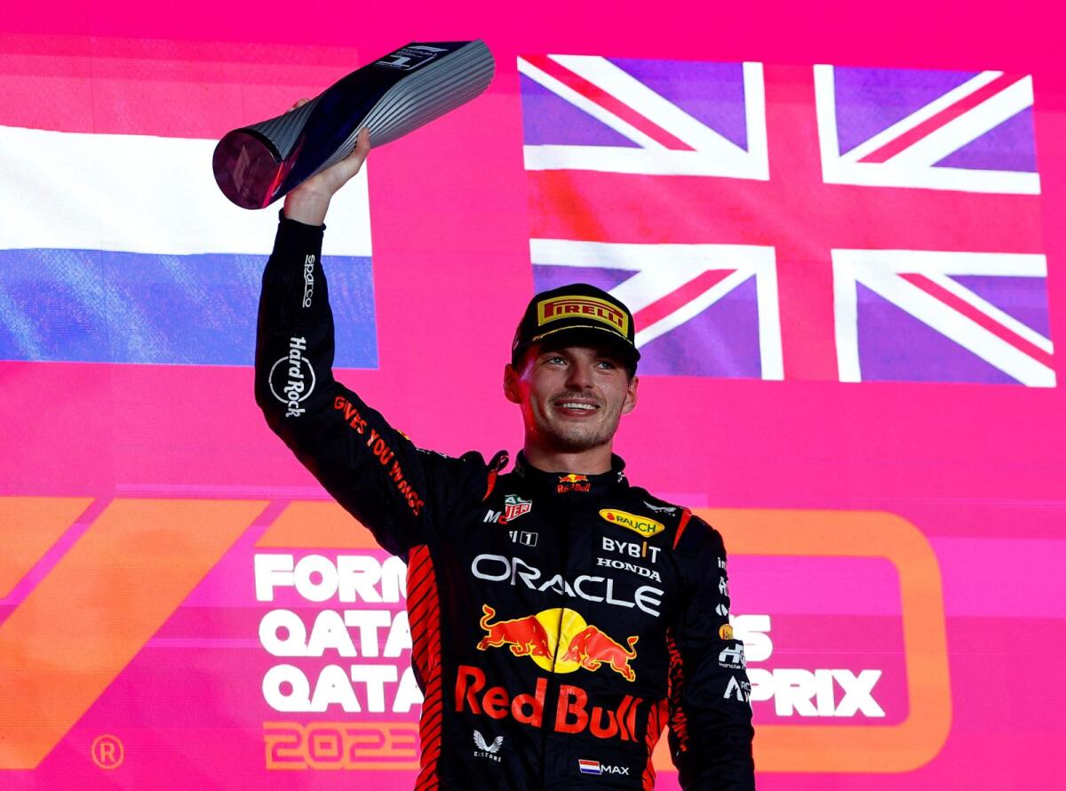 Max Verstappen of Red Bull celebrates with his trophy on the podium. — Reuters