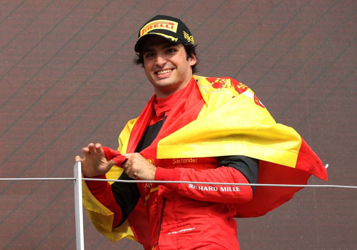 Ferrari's Carlos Sainz celebrates on the podium. (Reuters)