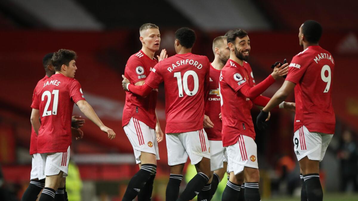 Manchester United's Scott McTominay celebrates his goal with teammates. — Reuters