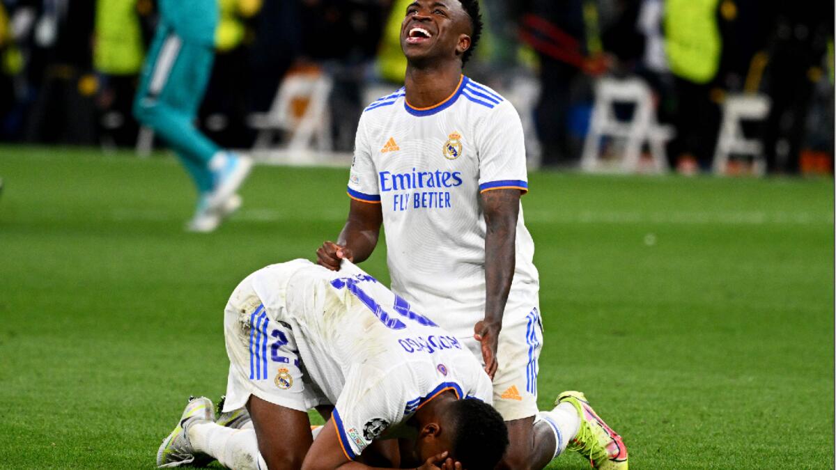 Real Madrid's Rodrygo and Vinicius Junior (top) celebrate after the stunning win over Manchester City. (AFP)