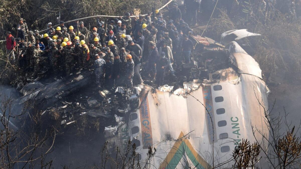 Rescue teams work to retrieve bodies from the wreckage at the crash site of an aircraft carrying 72 people in Pokhara in western Nepal January 15, 2023. Photo: Reuters