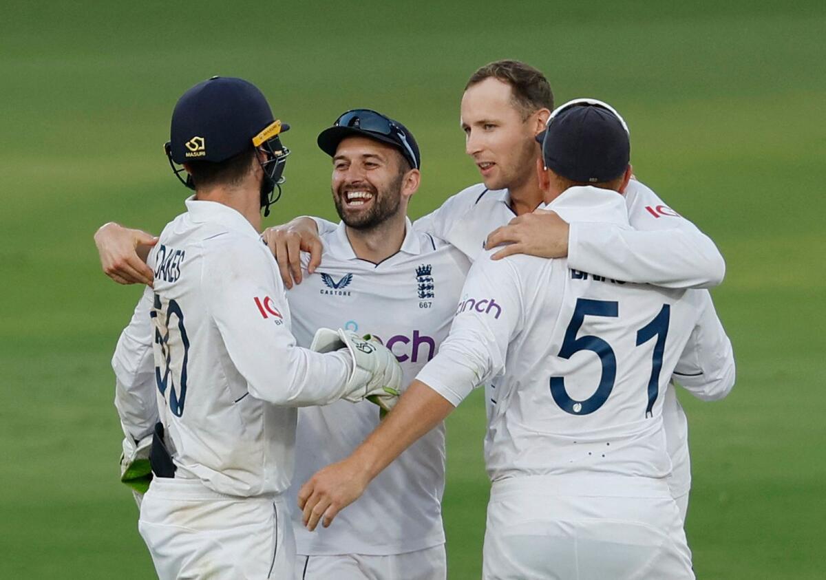 Englands Ben Foakes celebrates with Tom Hartley, Mark Wood and Jonny Bairstow after stumping out India's Mohammed Siraj to win the first Test - Reuters