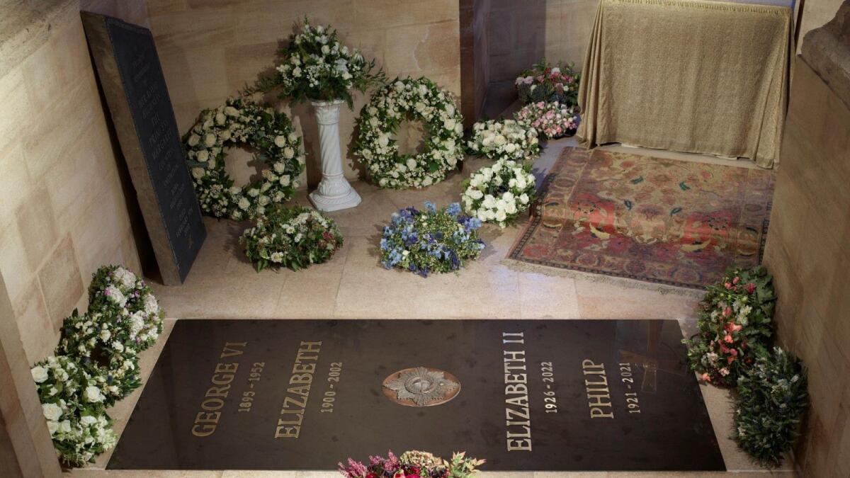 An inscribed stone slab marking the death of Queen Elizabeth II has been laid in the Windsor Castle chapel where her coffin was interred. – AFP