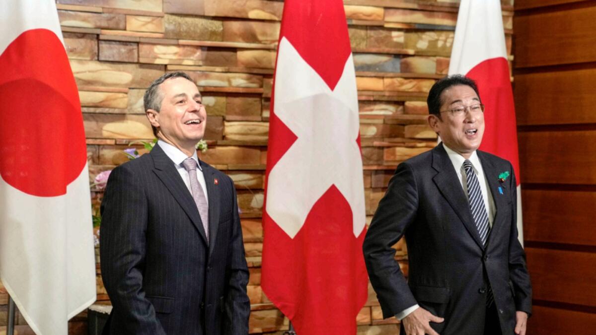 Swiss President Ignazio Cassis and Japanese Prime Minister Fumio Kishida before their meeting at the Prime Minister's residence in Tokyo. — AP