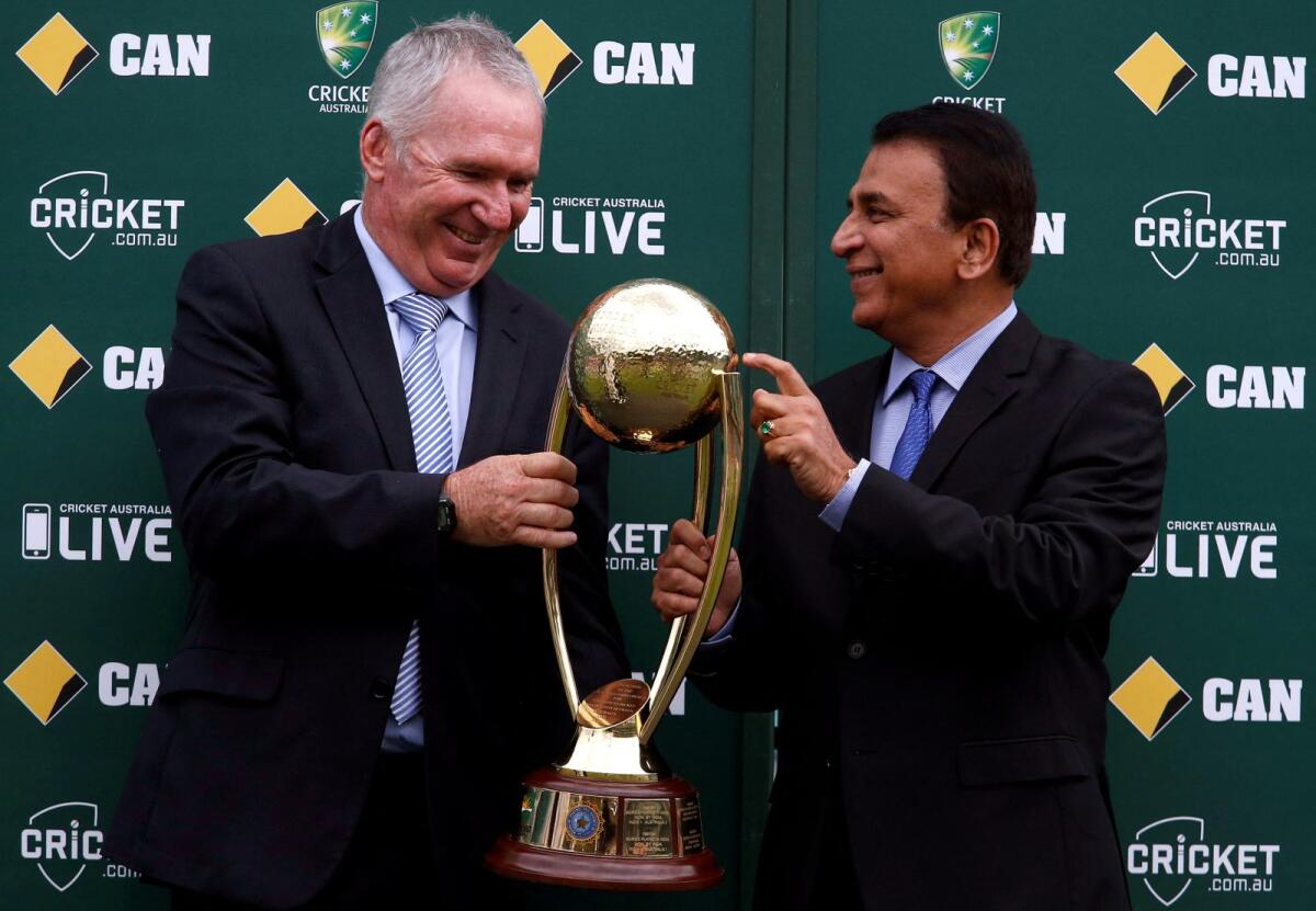The Border-Gavaskar trophy is held by Allan Border and Sunil Gavaskar. — Reuters file