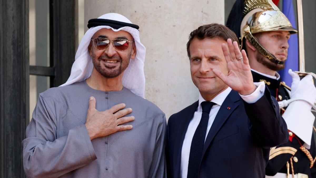 France's President Emmanuel Macron (R) welcomes UAE President Sheikh Mohamed bin Zayed Al-Nahyan (L) Photo: AFP