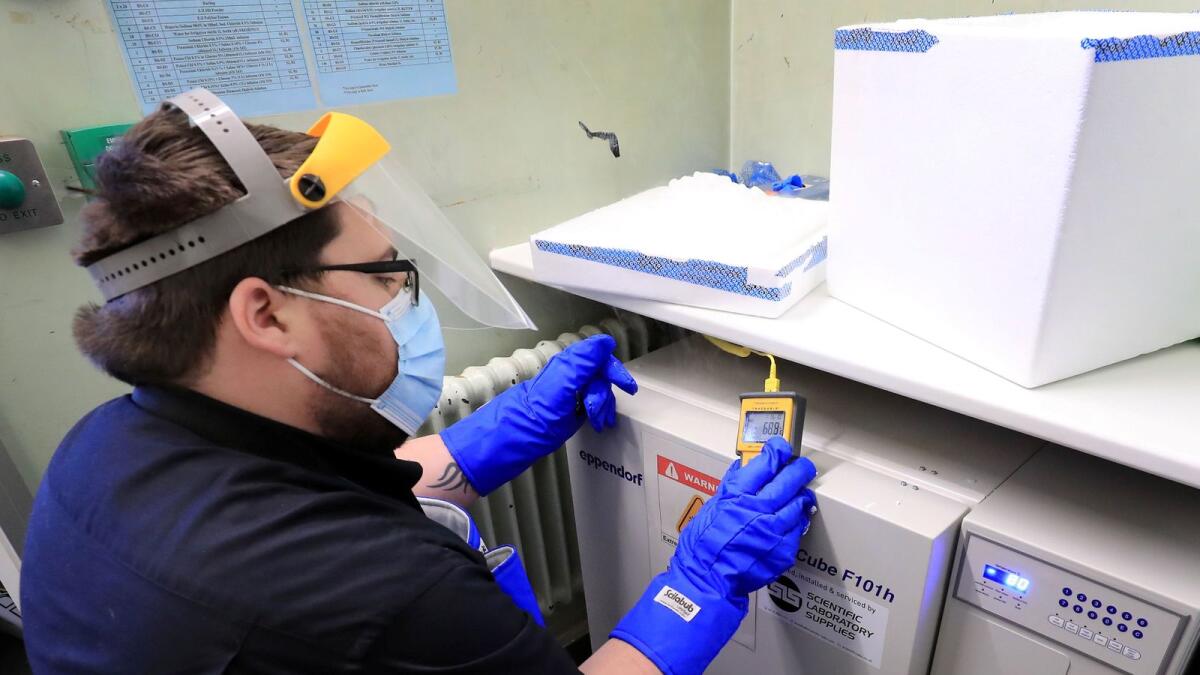 A pharmacy technician from Croydon Health Services prepares a delivery of the first batch of COVID-19 vaccinations at Croydon University Hospital in Croydon, Britain December 5, 2020.
