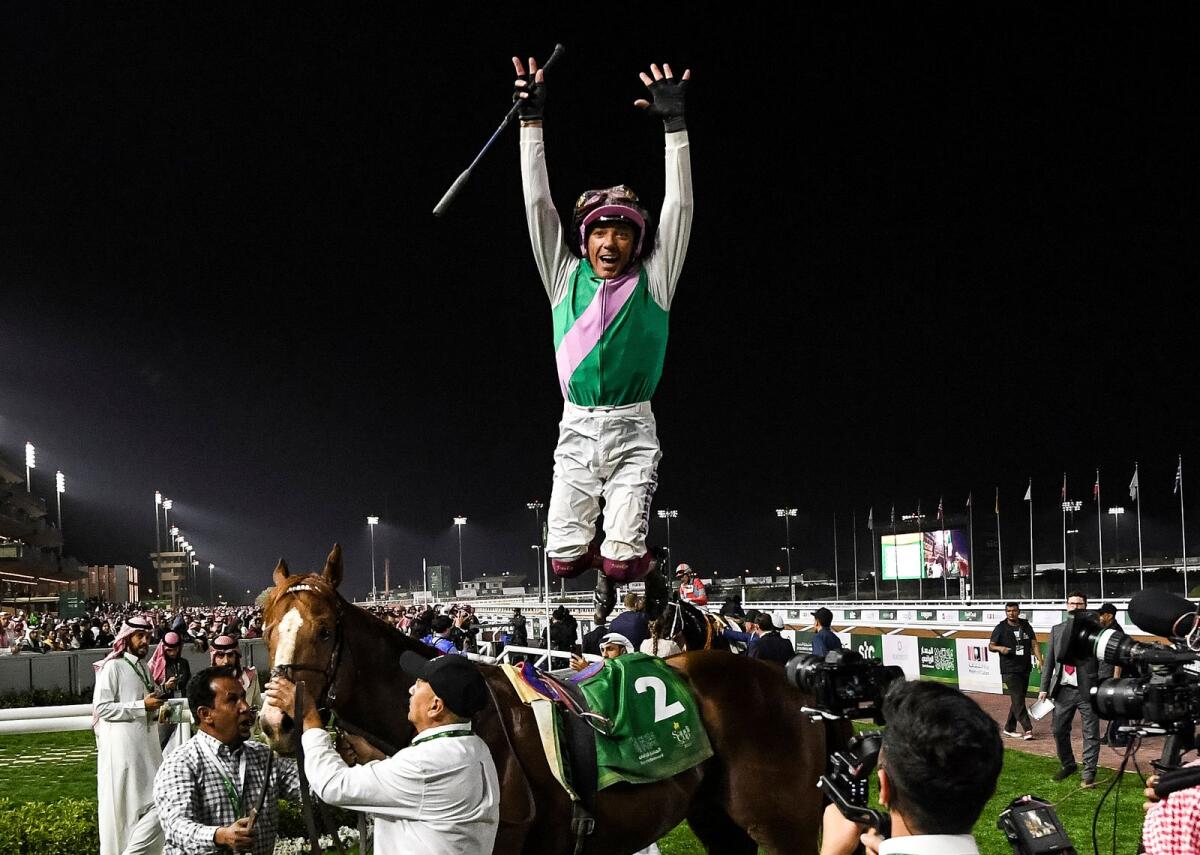 Frankie Dettori performs his trademark flying dismount after winning the G3 Riyadh Dirt Sprint over 1200m at the King Abdulaziz racetrack in Riyadh on February 25, 2023. — AP file