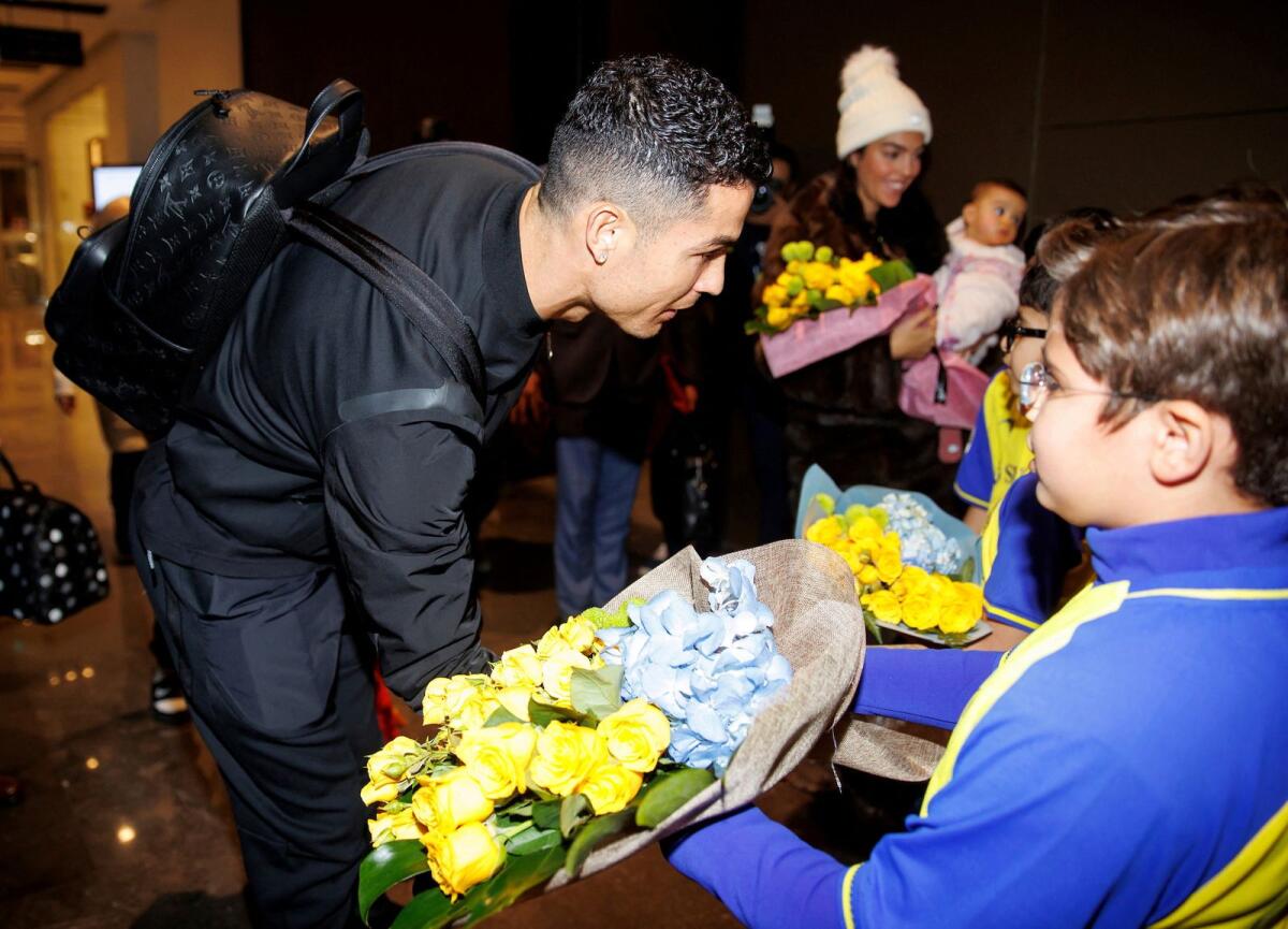 Cristiano Rolando and his family arrive in Saudi Arabia. -- Reuters