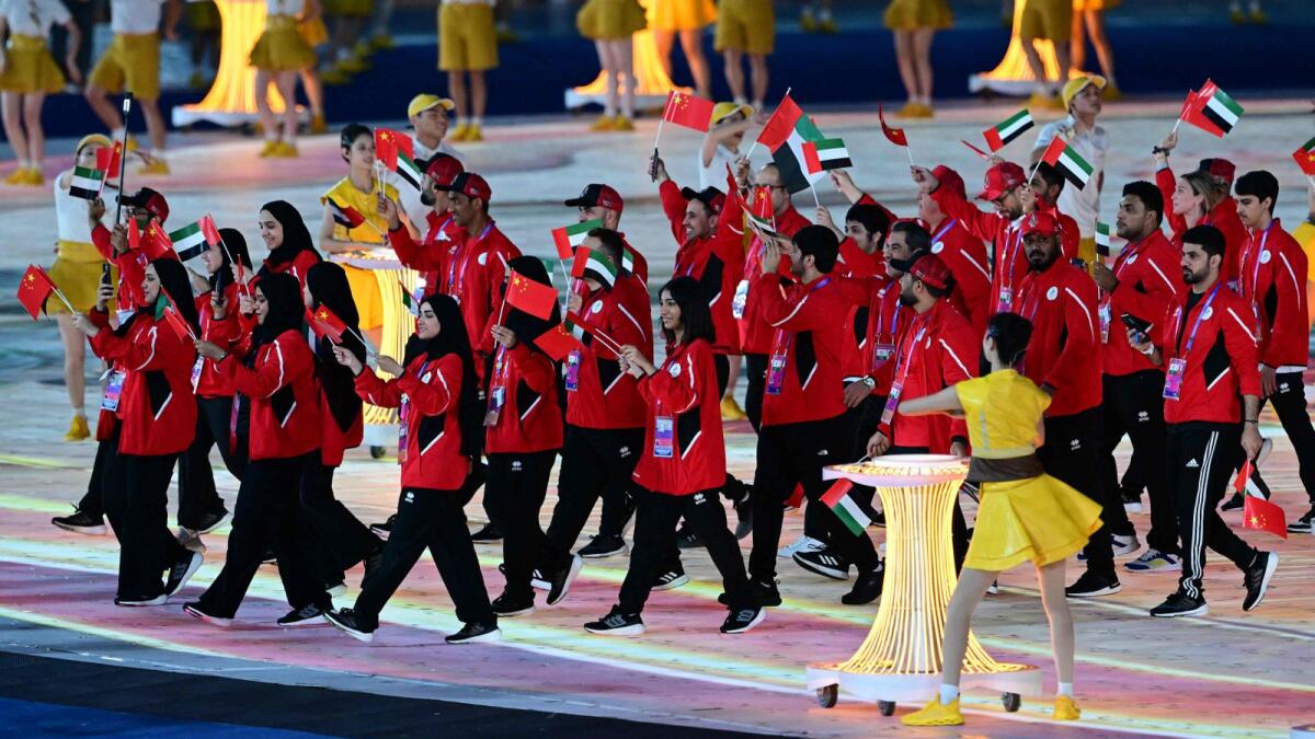 Members of the UAE delegation take part in the athletes parade during the opening ceremony of the 2022 Asian Games at the Hangzhou Olympic Sports Centre Stadium. - AFP